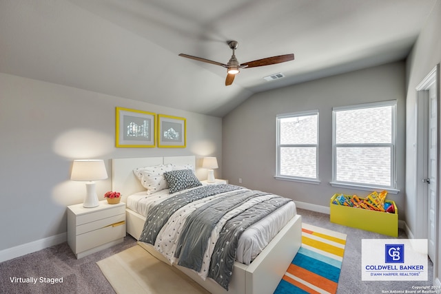 bedroom with ceiling fan, vaulted ceiling, and light carpet