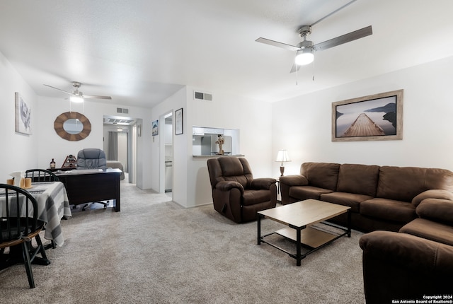 living room featuring ceiling fan and light carpet