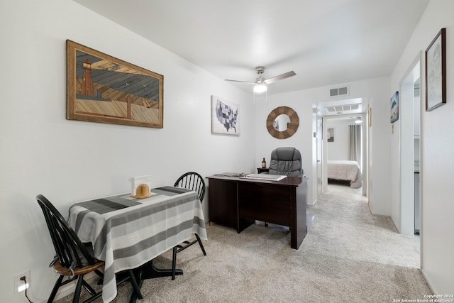 carpeted office with ceiling fan