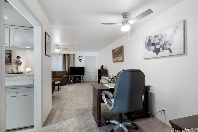 carpeted office with ceiling fan