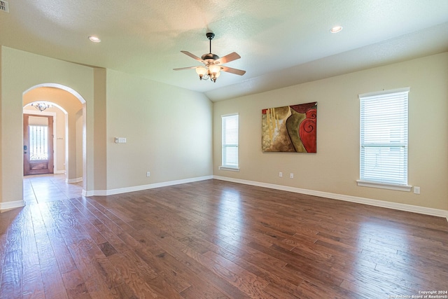 unfurnished room with dark hardwood / wood-style floors, a textured ceiling, and ceiling fan