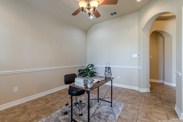 office with ceiling fan, lofted ceiling, and light tile patterned floors