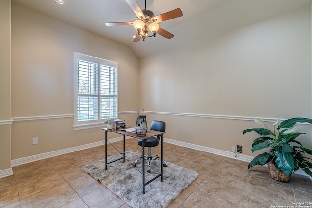 office area with ceiling fan, light tile patterned floors, and vaulted ceiling