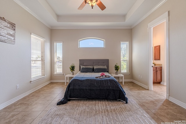 bedroom with ceiling fan, ornamental molding, ensuite bathroom, and multiple windows