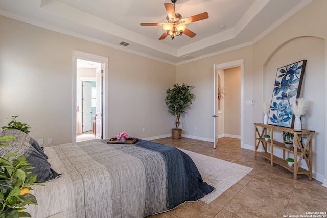 tiled bedroom with a raised ceiling, crown molding, and ceiling fan