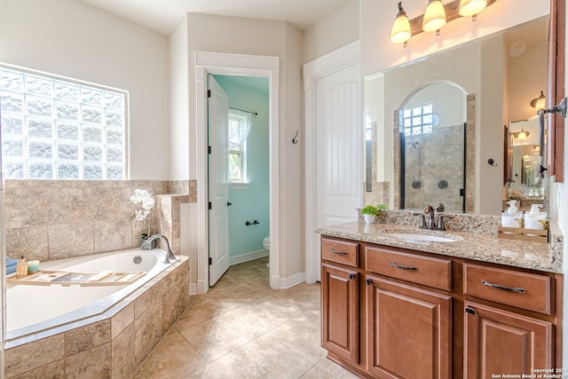 full bathroom featuring tile patterned floors, toilet, vanity, and independent shower and bath