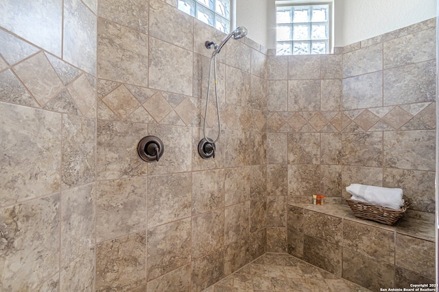 bathroom featuring a tile shower