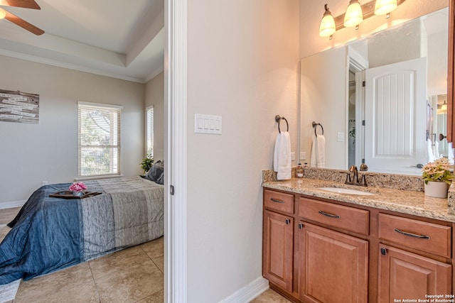 bathroom with tile patterned flooring, ornamental molding, vanity, and ceiling fan