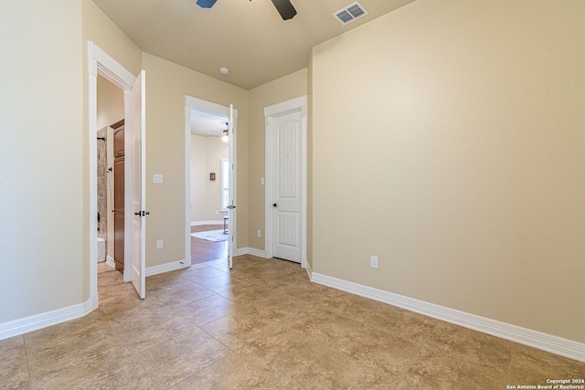 interior space with ceiling fan