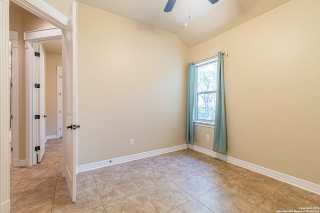 tiled spare room with ceiling fan and lofted ceiling