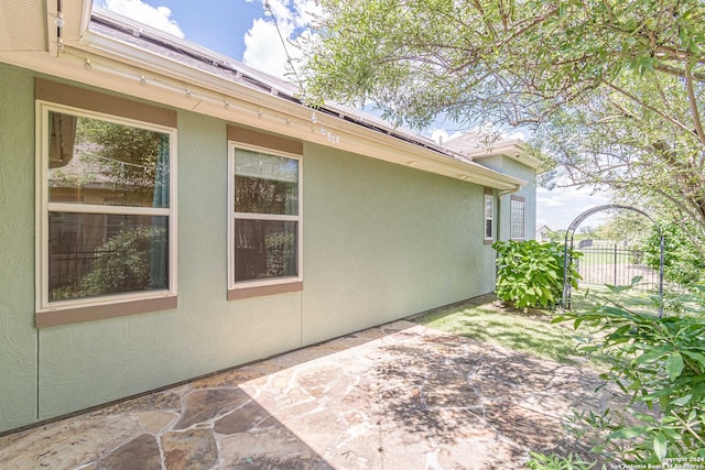 view of side of property featuring a patio area