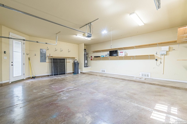 garage featuring a garage door opener, electric panel, and water heater