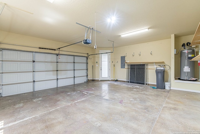 garage featuring a garage door opener, electric panel, and water heater