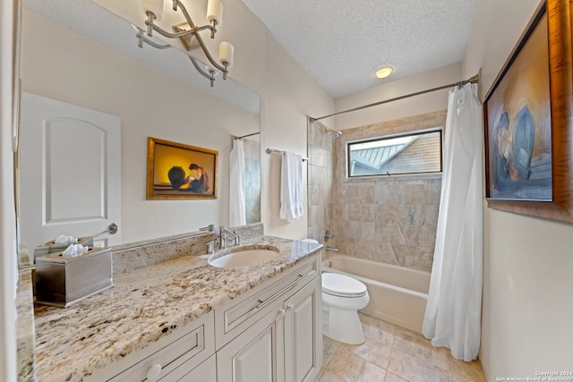 full bathroom featuring vanity, tile patterned flooring, shower / bath combo, toilet, and a textured ceiling