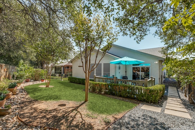 rear view of house featuring a lawn