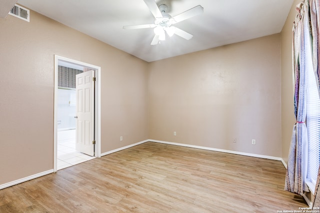 unfurnished room featuring ceiling fan and light hardwood / wood-style floors