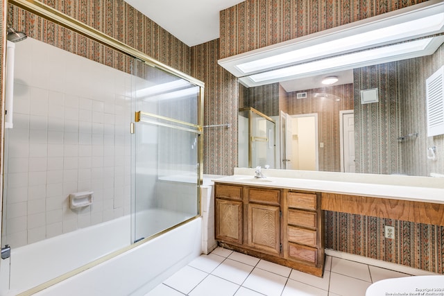 full bathroom with tile patterned flooring, combined bath / shower with glass door, toilet, and vanity