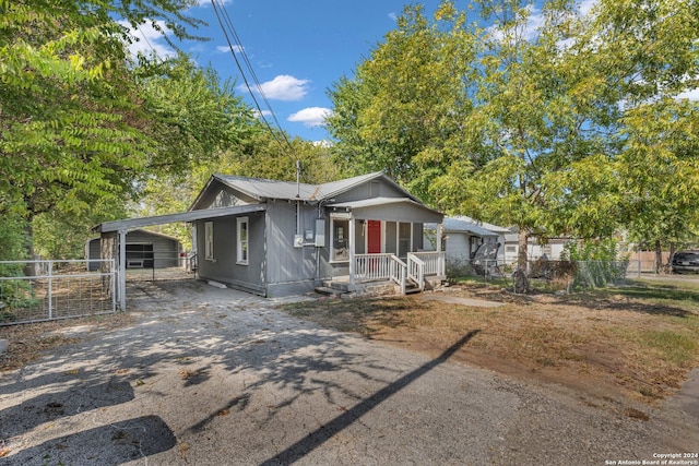 bungalow-style house featuring a carport