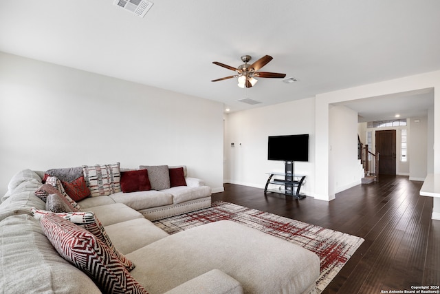 living room with ceiling fan and dark hardwood / wood-style floors