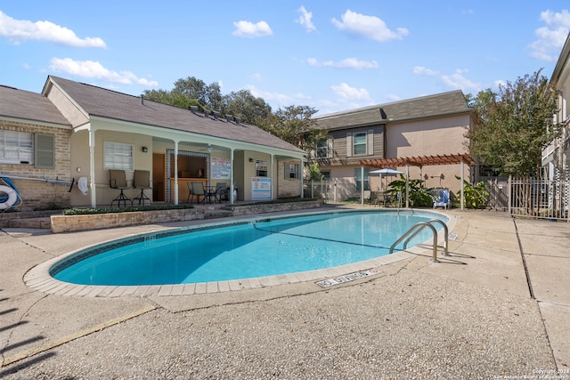 view of swimming pool with a patio area