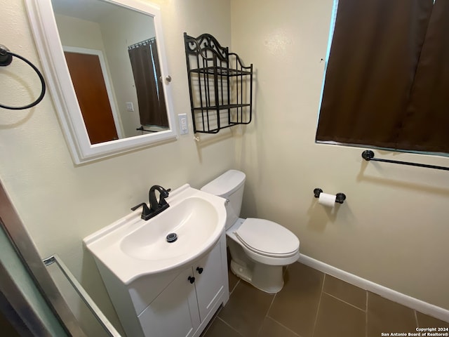 bathroom with tile patterned floors, vanity, and toilet