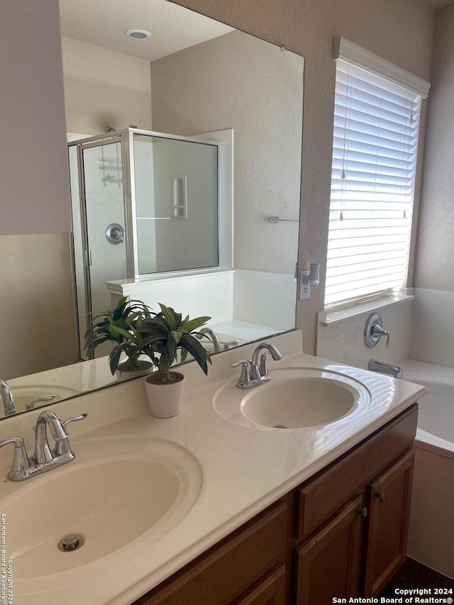 bathroom with vanity and plus walk in shower