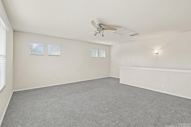 unfurnished room with carpet flooring and ceiling fan