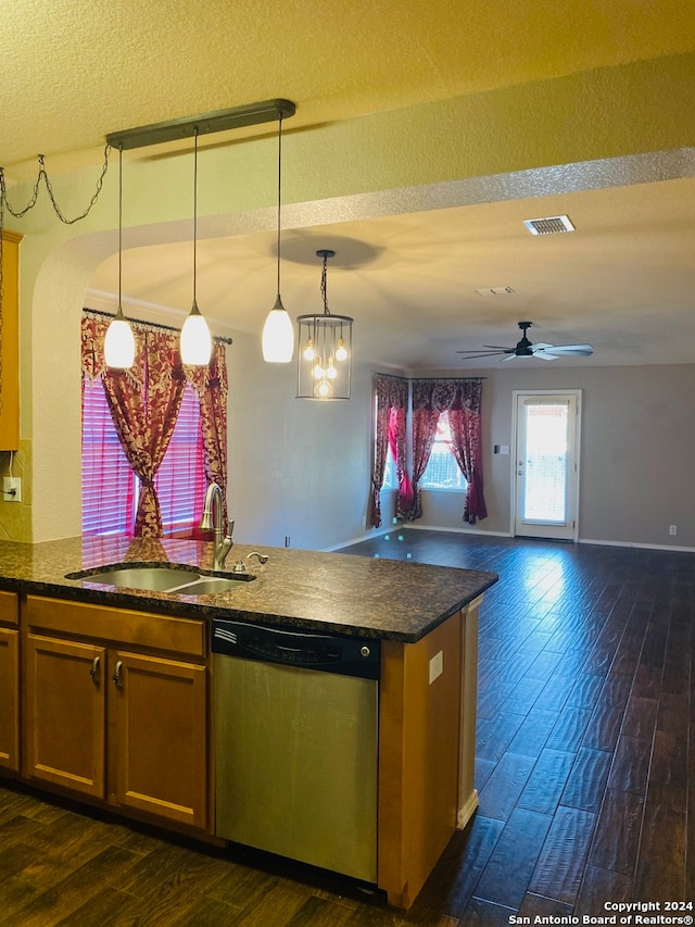 kitchen with ceiling fan with notable chandelier, sink, stainless steel dishwasher, dark hardwood / wood-style floors, and decorative light fixtures