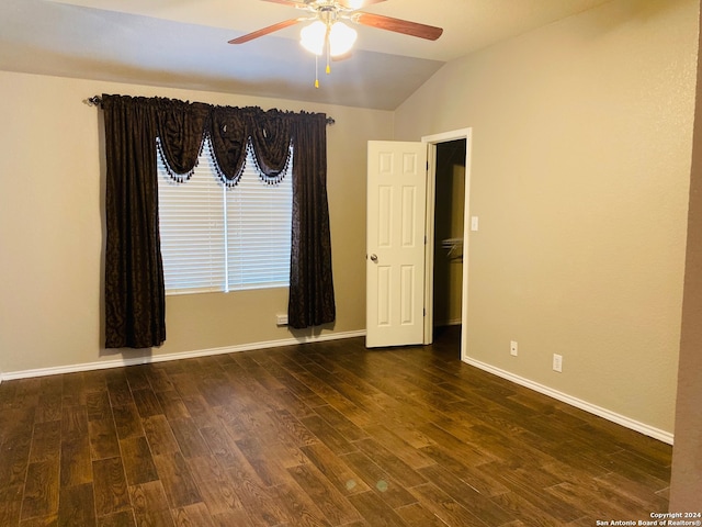 unfurnished room featuring ceiling fan, dark hardwood / wood-style flooring, and lofted ceiling