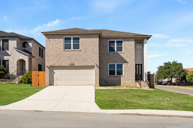 view of front of house featuring a garage and a front lawn