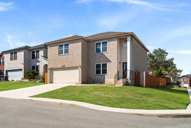 view of front of home featuring a front lawn and a garage