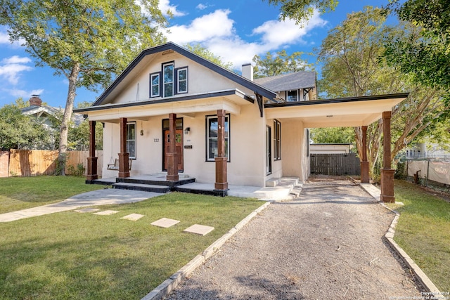 722 E Drexel Ave, San Antonio, TX 78210 - bungalow-style house with covered porch, driveway, stucco siding, and a chimney