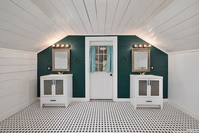 722 E Drexel Ave, San Antonio, TX 78210 - bathroom featuring lofted ceiling, vanity, wood ceiling, wooden walls, and baseboards