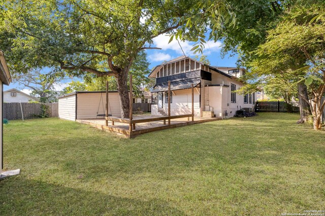 722 E Drexel Ave, San Antonio, TX 78210 - back of house featuring a wooden deck and an outdoor structure
