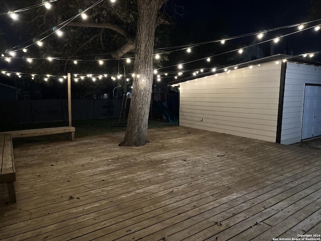 722 E Drexel Ave, San Antonio, TX 78210 - deck at night featuring a fenced backyard