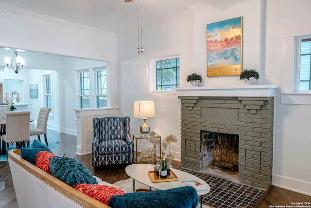 living room with a fireplace, crown molding, and dark wood-type flooring