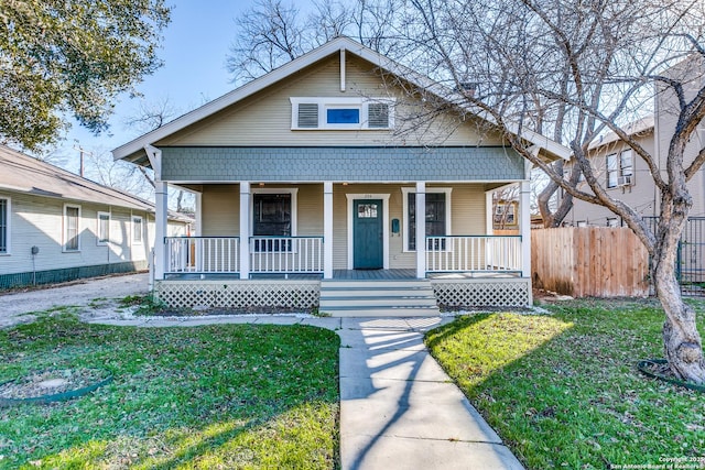 204 Queen Anne, San Antonio, TX 78209 - bungalow-style home with a front yard, fence, and covered porch