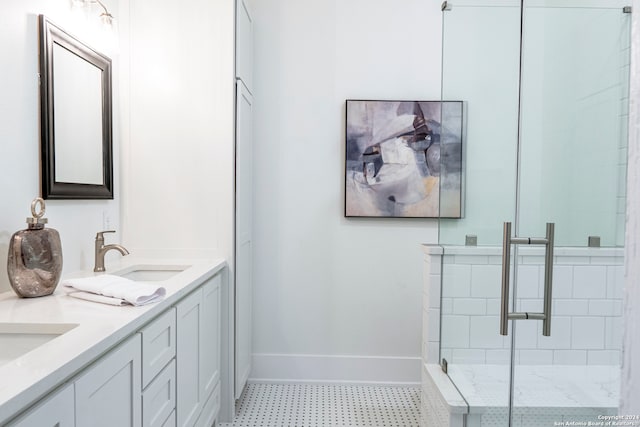 bathroom with vanity and a shower with door