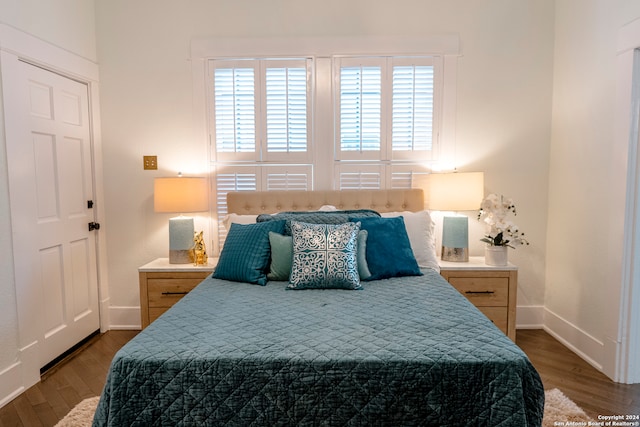 bedroom featuring dark hardwood / wood-style floors