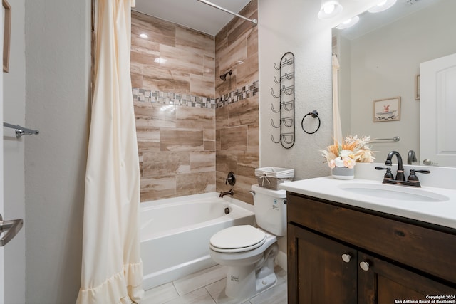 full bathroom featuring tile patterned flooring, vanity, shower / tub combo, and toilet