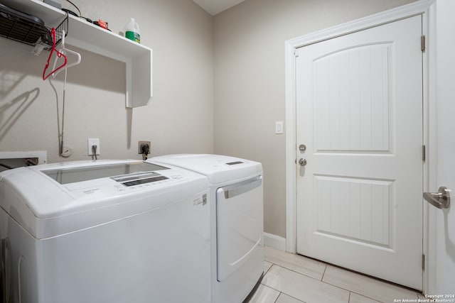 laundry room with washing machine and clothes dryer