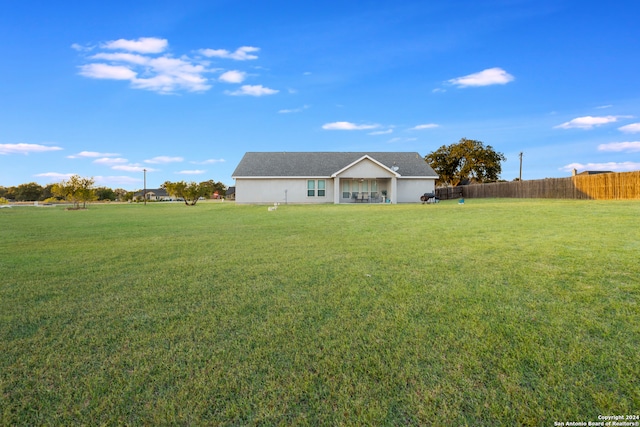 ranch-style home featuring a front yard