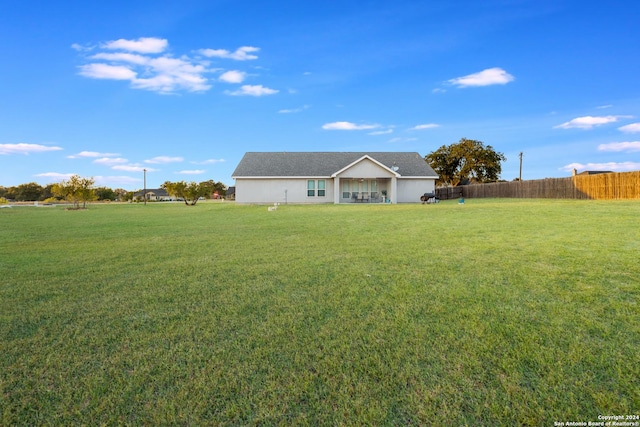 120CHAMPIONSB Champions Blvd, La Vernia, TX 78121 - view of front of home featuring fence and a front lawn