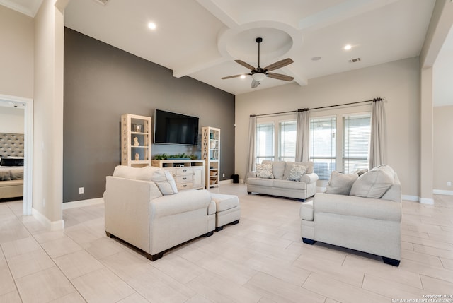 living room with ceiling fan, beam ceiling, and coffered ceiling