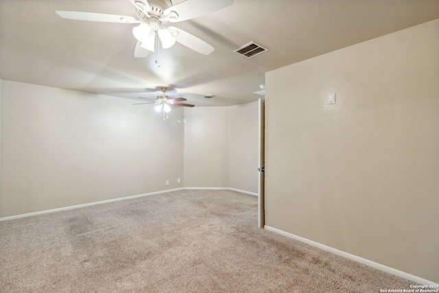 empty room featuring carpet flooring and ceiling fan