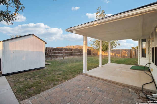 view of patio featuring a shed