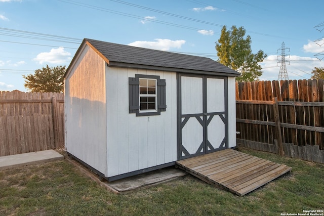 view of outdoor structure featuring a lawn