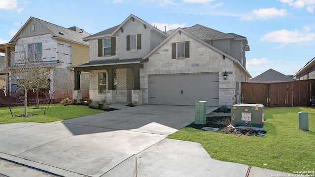 view of front of home with a garage and a front yard