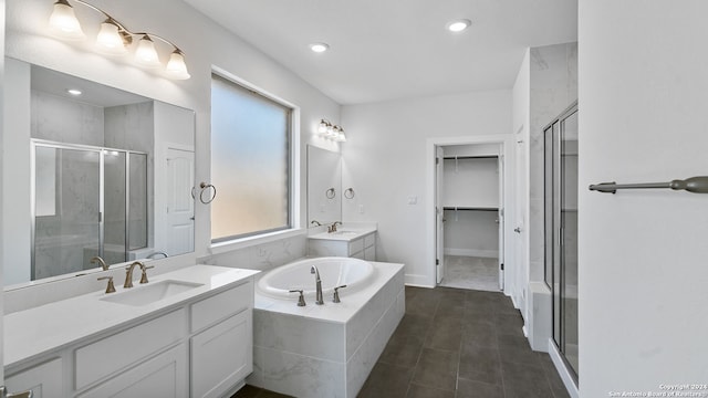 bathroom with vanity and independent shower and bath