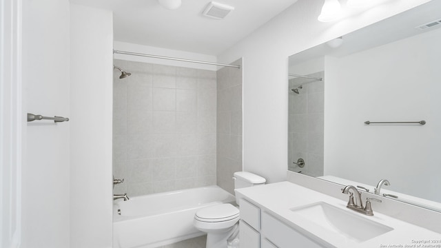 full bathroom featuring vanity, toilet, and tiled shower / bath combo